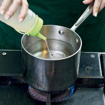 Fill a pot with water until two-thirds full. Add a s dash of white vinegar-this aids in the eggâ€™s coagulation. 